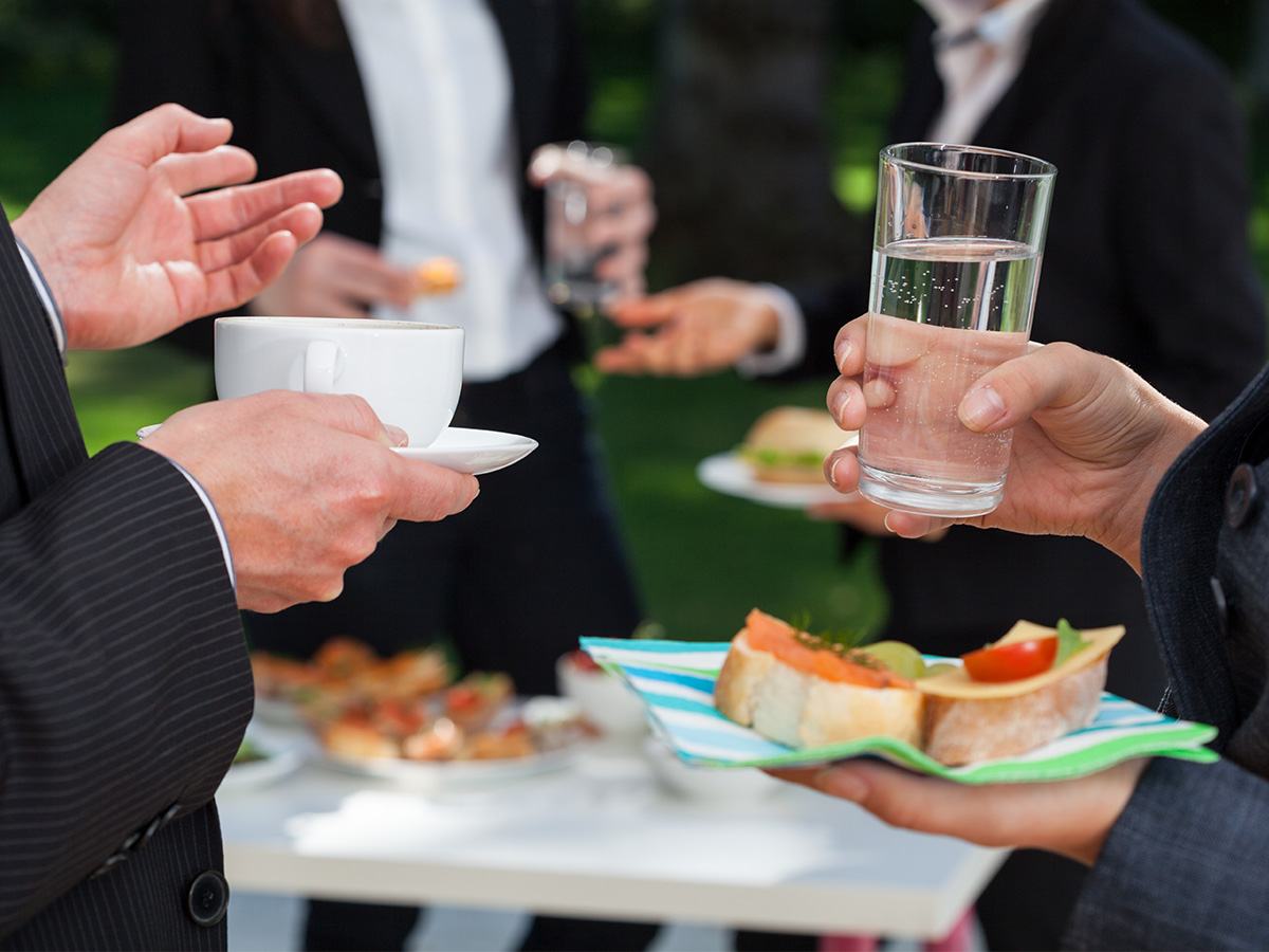 People eating and drinking at a corporate event