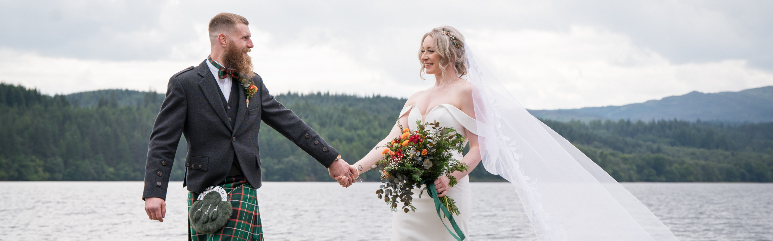 Couple on the banks of Loch Venachar winter wedding